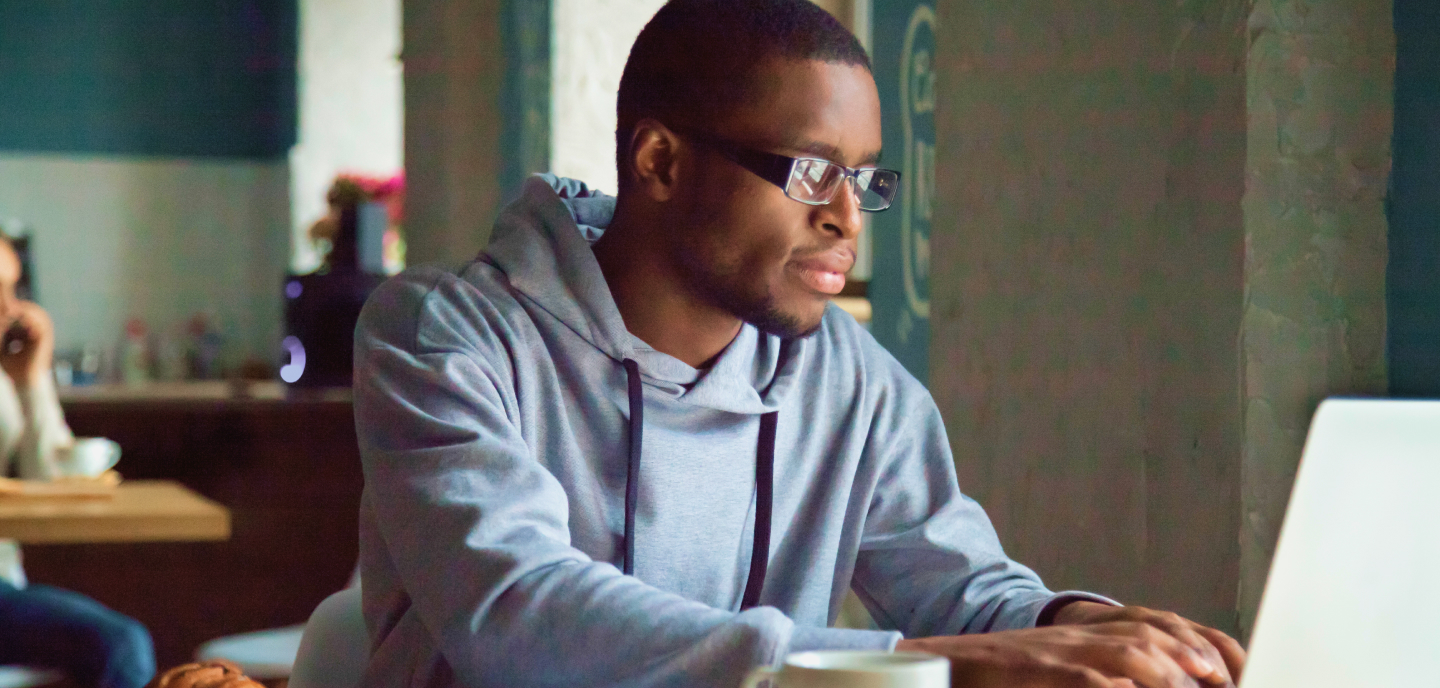 Man completing an online application form