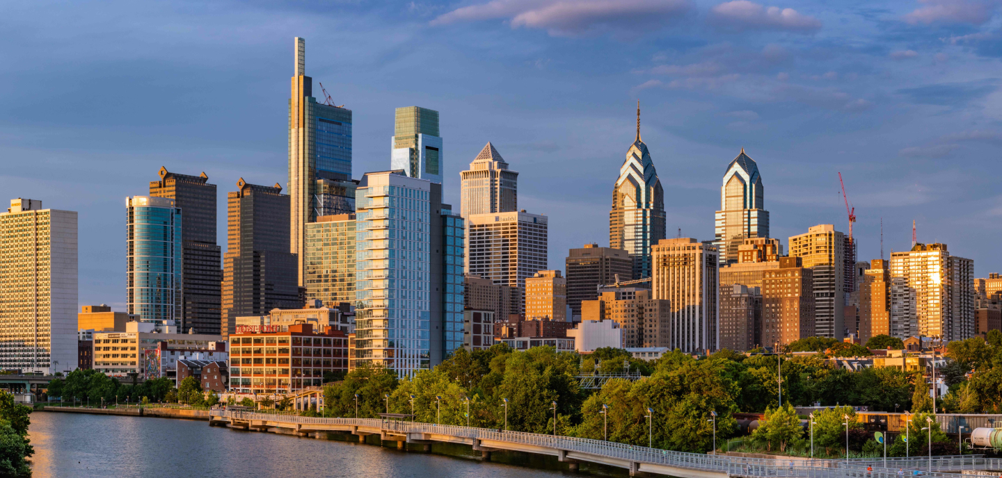Philadelphia skyline amid a warm sunset.
