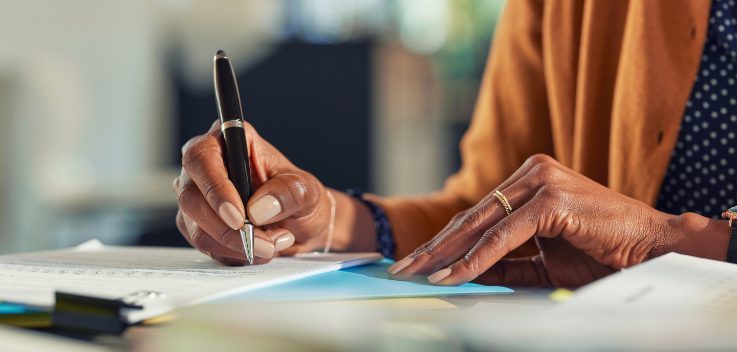 Researcher editing a paper at her desk.