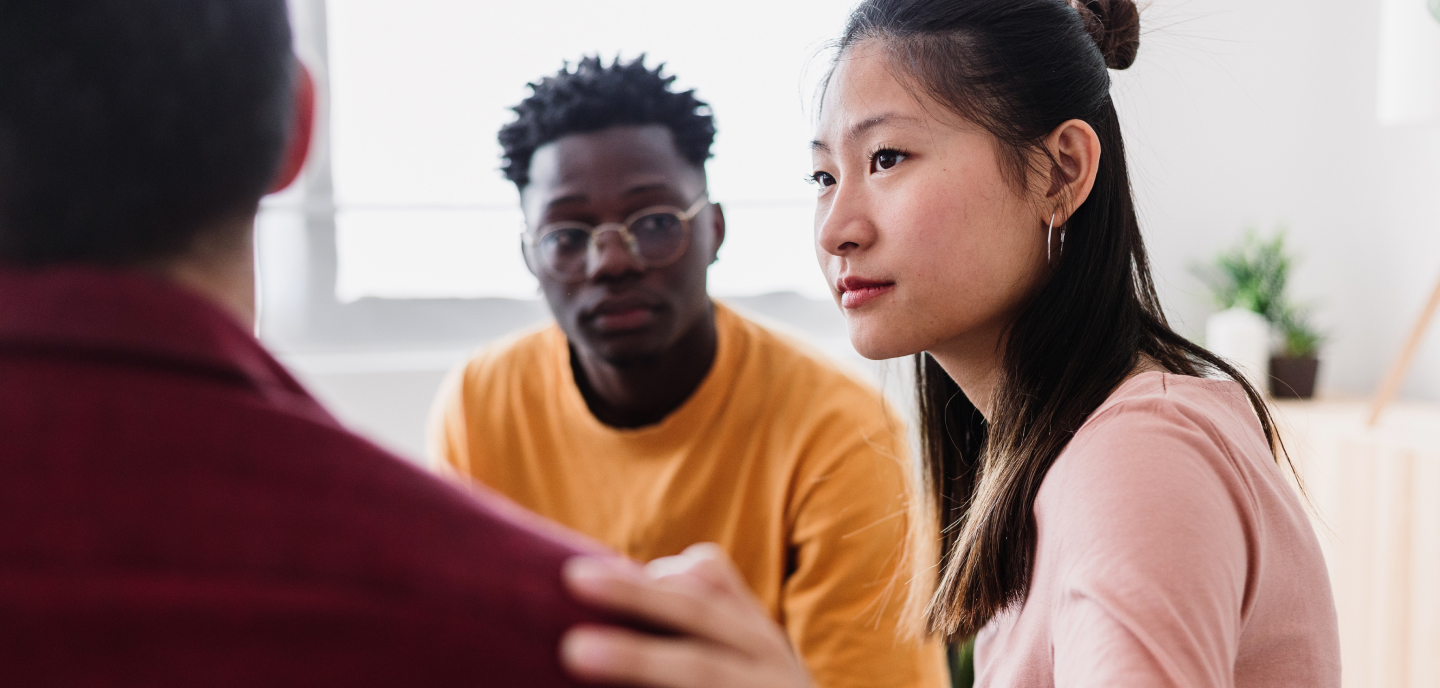 People sitting in a circle during a peer recovery discussion.